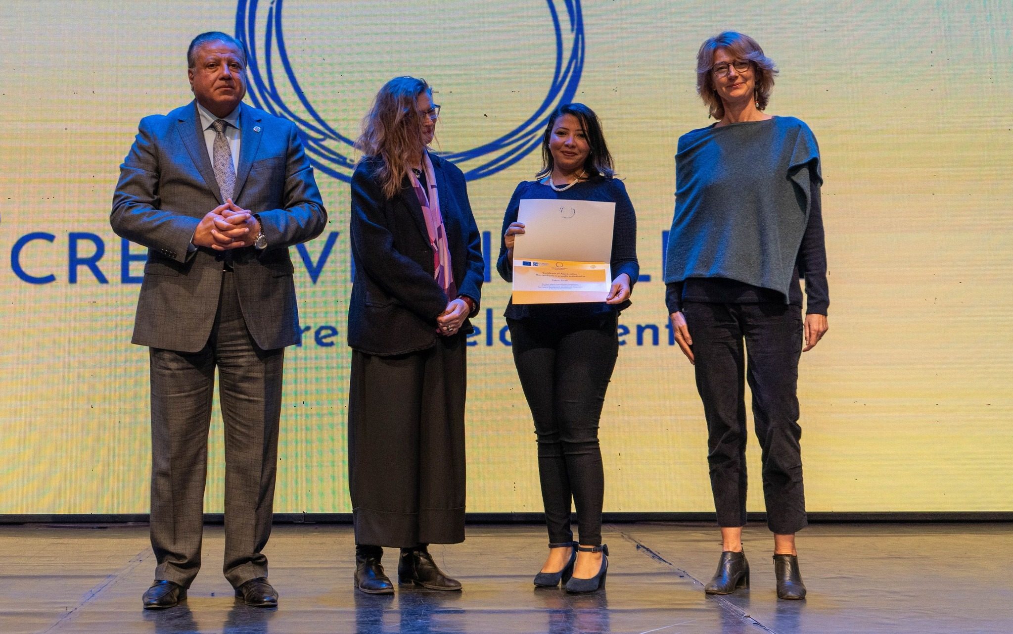An award being presented on stage