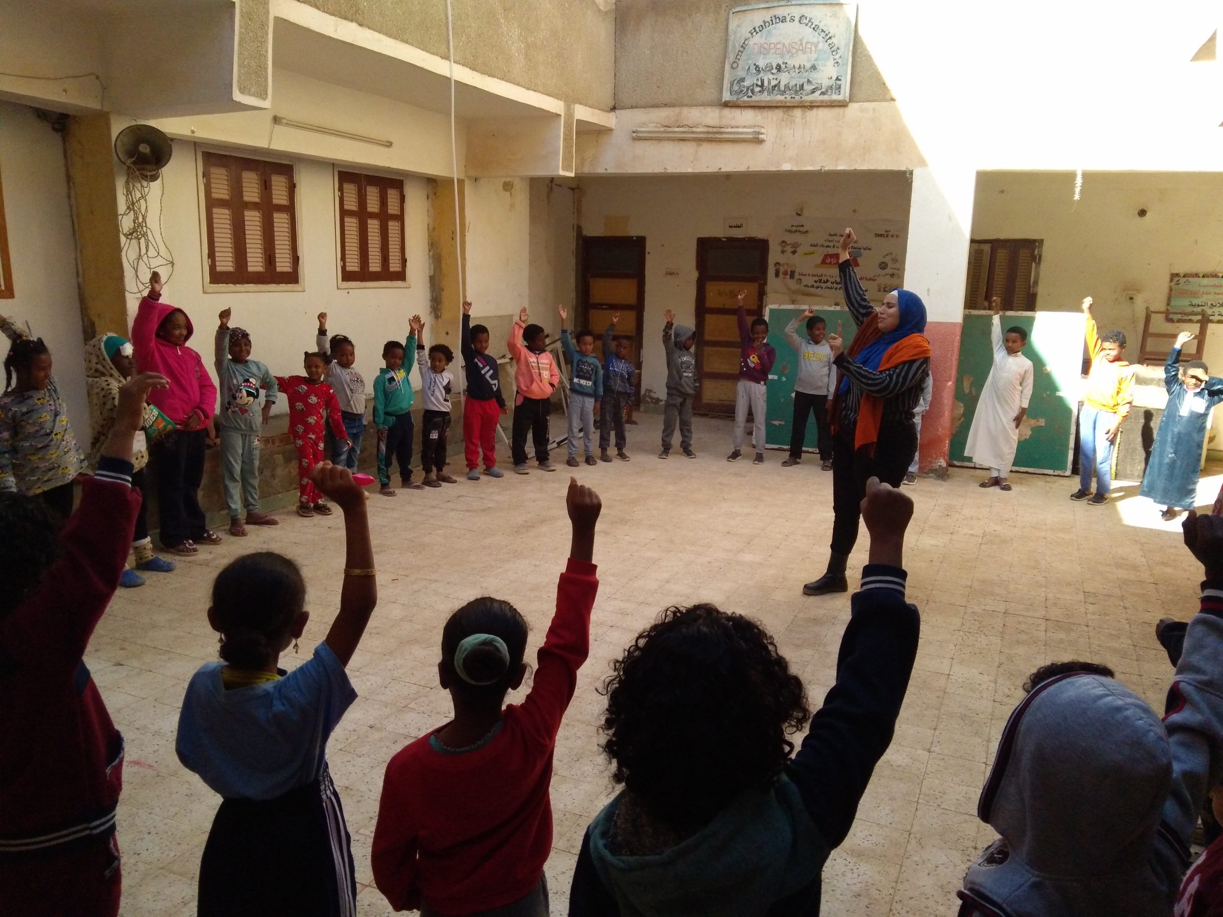 Participants raising their hands during a community session