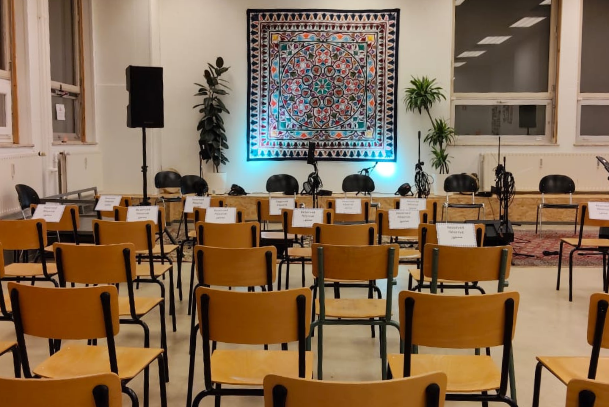 An event hall arranged with seating before an event